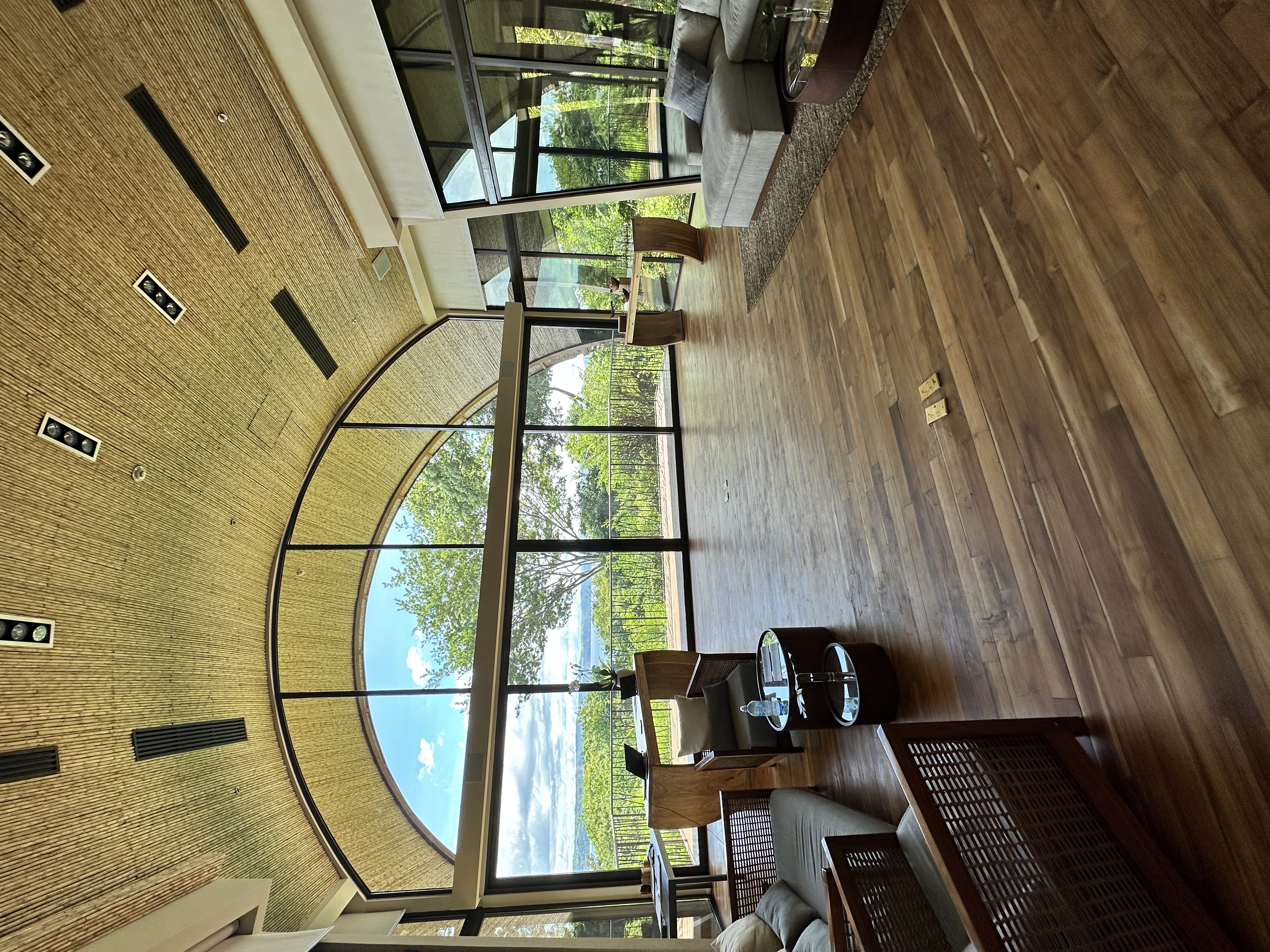 The Andaz Papagayo open-air lobby with dramatic arched bamboo ceiling framing the Pacific