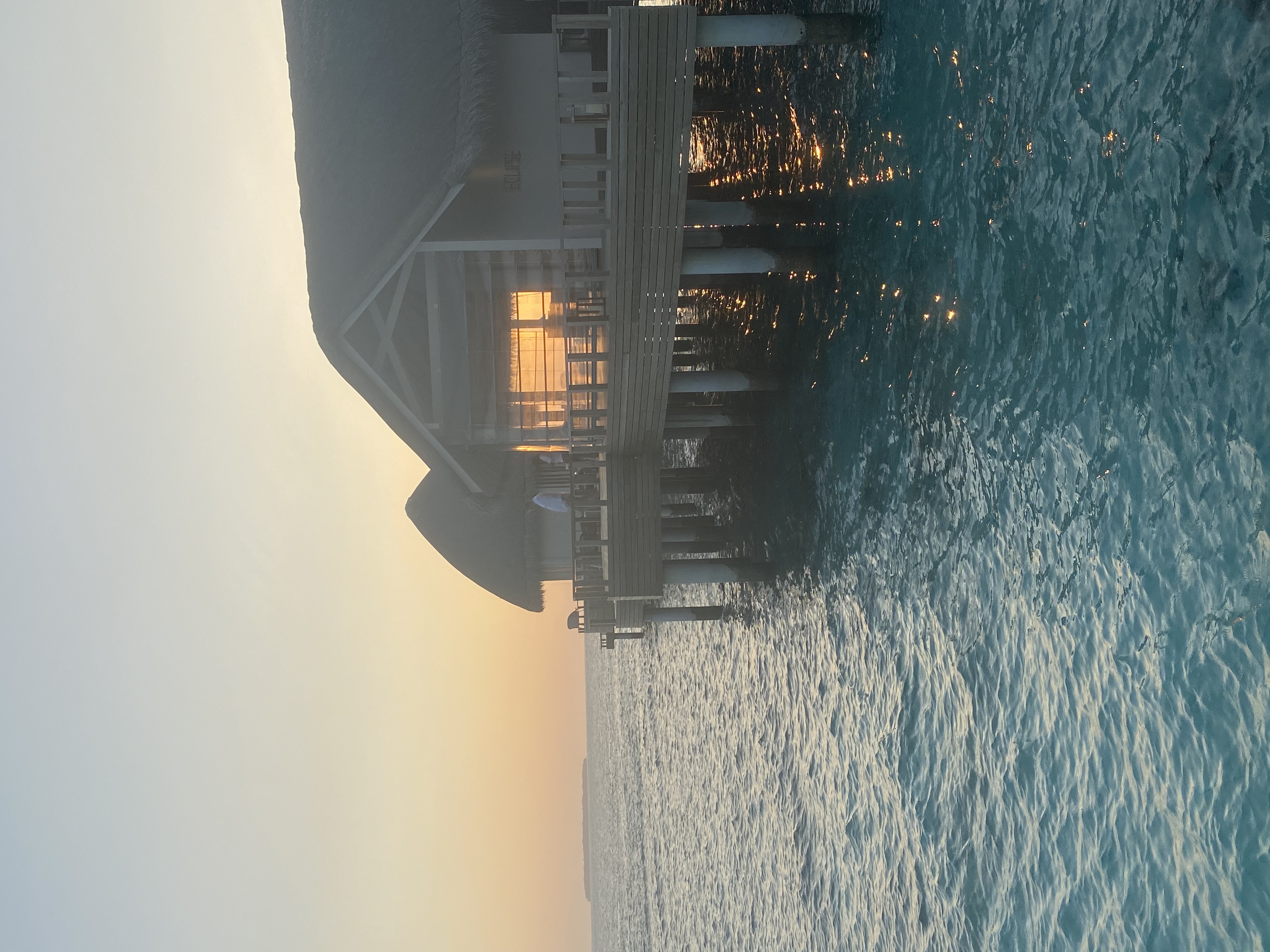 Overwater villa at Faarufushi Maldives at golden hour