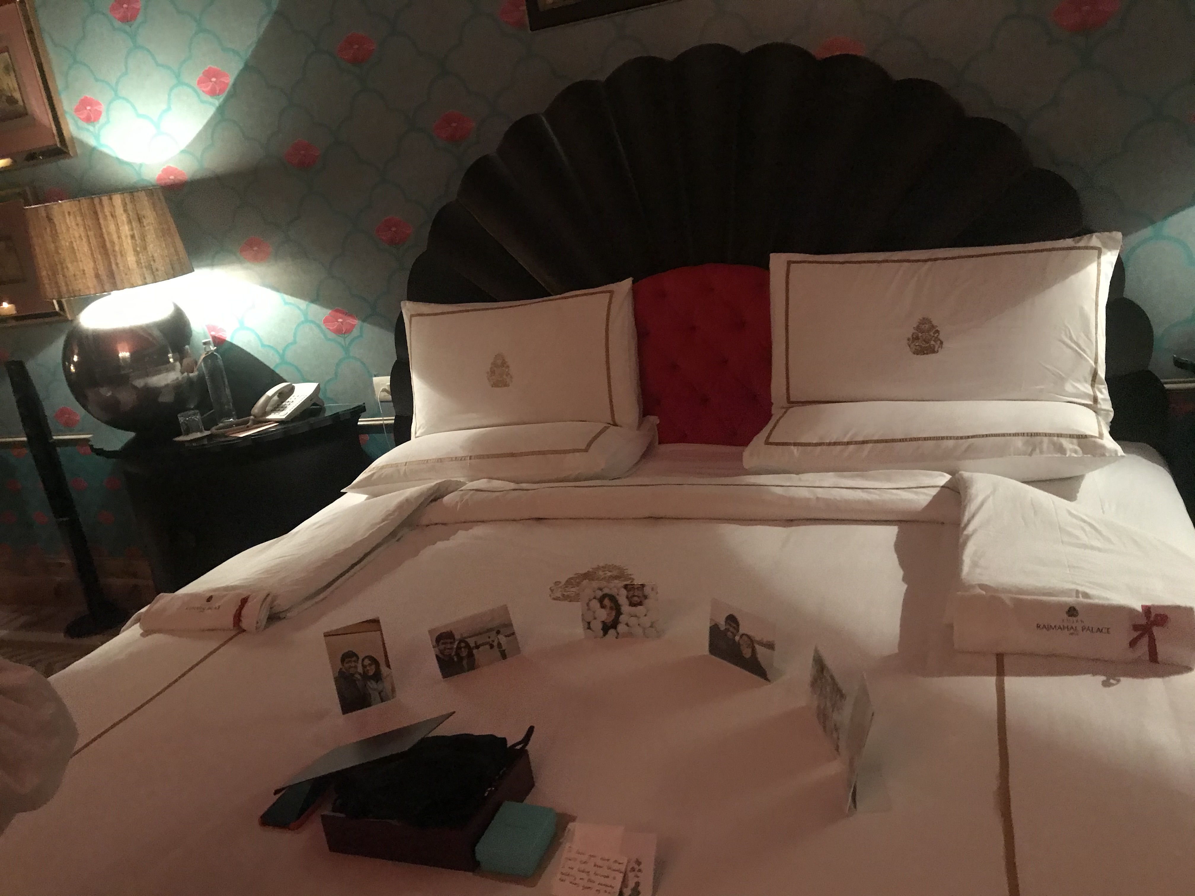 Personalized turndown with printed photos, handwritten note, and gift at Rajmahal