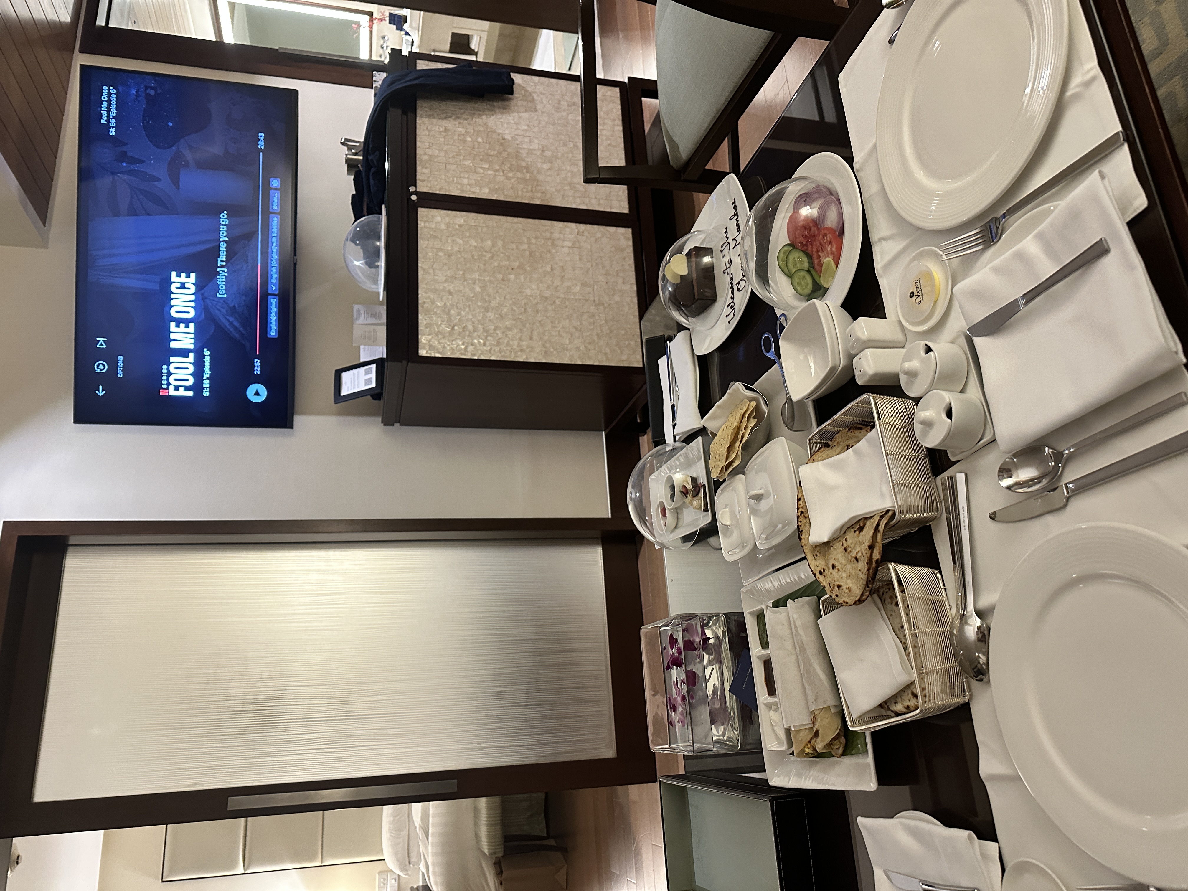 Indian dinner spread with naan and curries in the suite at The Oberoi Mumbai